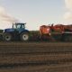 Синий трактор в поле. Сельское хозяйство