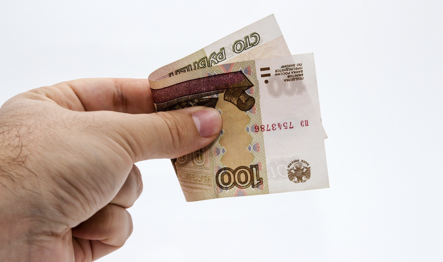 рука держит деньги