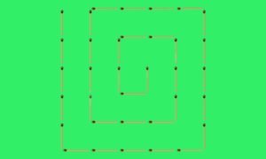 спираль из спичек на зелёном фоне