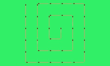 спираль из спичек на зелёном фоне