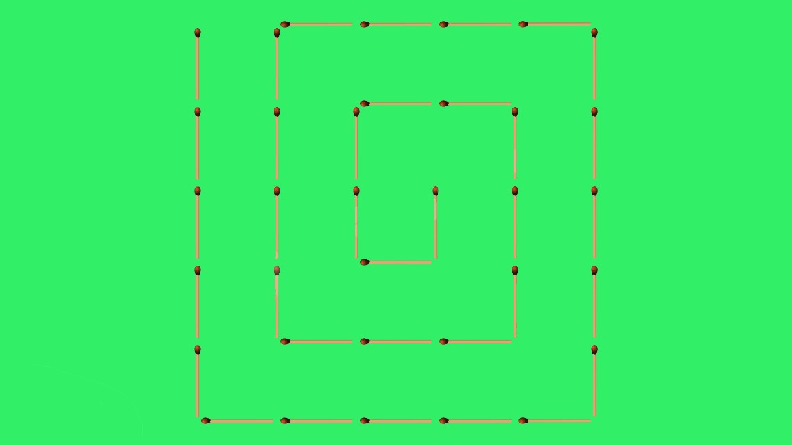 спираль из спичек на зелёном фоне